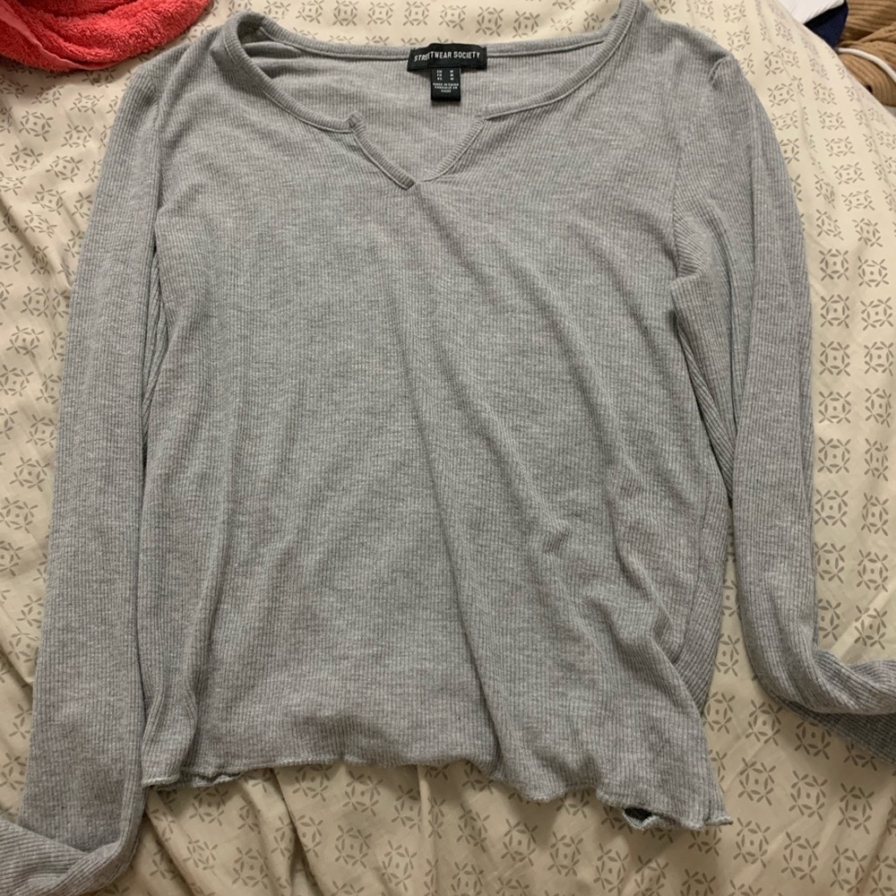 Grey long sleeve shirt.